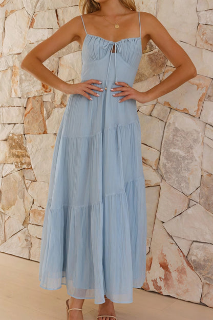 Maxi dress with spaghetti straps, open back, and flared skirt